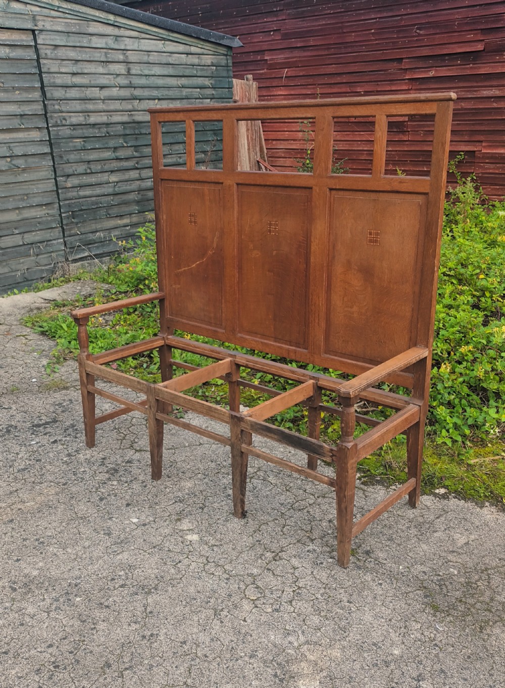 Interesting arts and crafts oak hall settle.