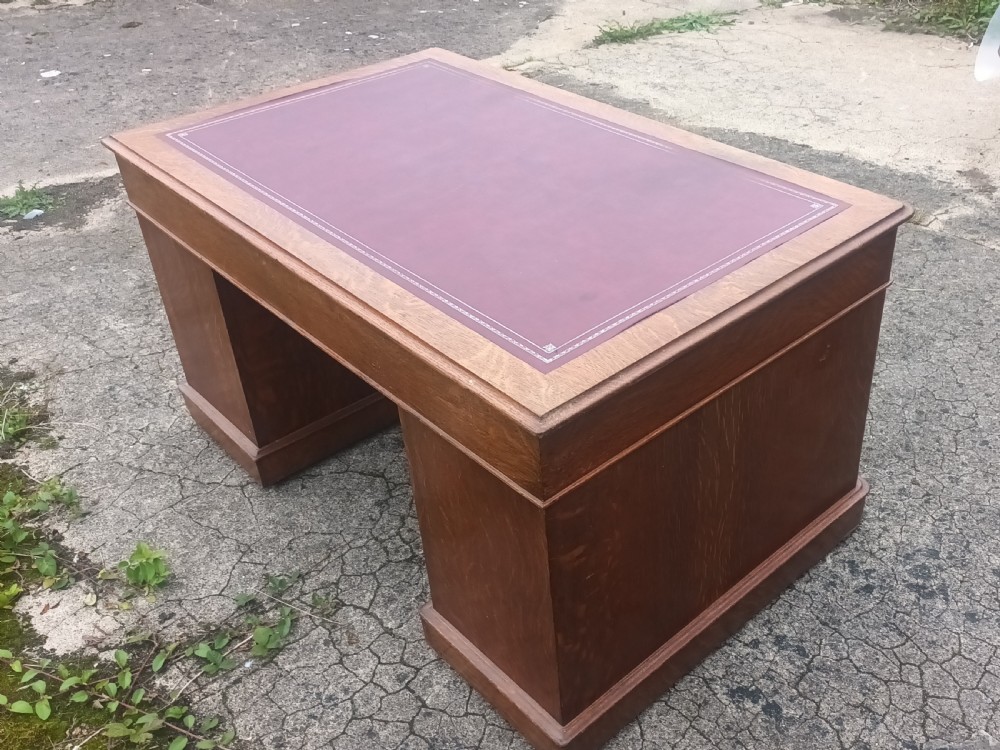 Late Victorian oak kneehole pedestal desk with campaign style handles. View IV