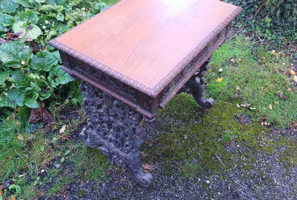 Carved Anglo Indian rosewood side table with drawer. View II