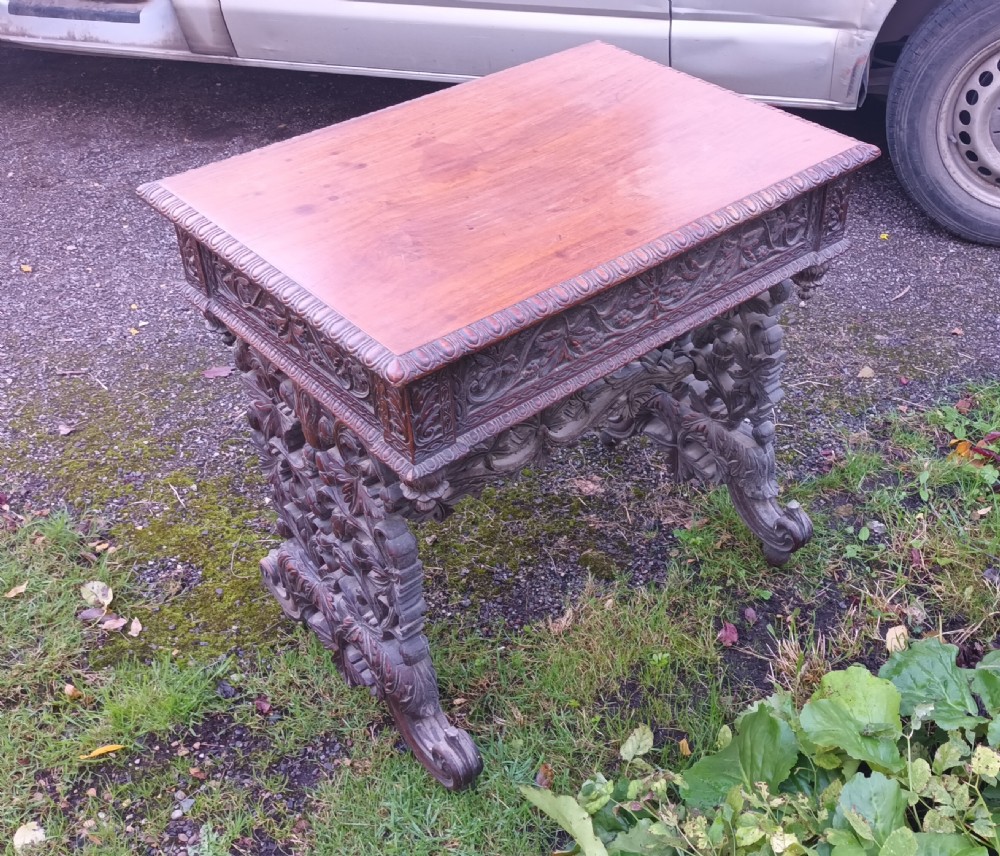 Carved Anglo Indian rosewood side table with drawer. View III