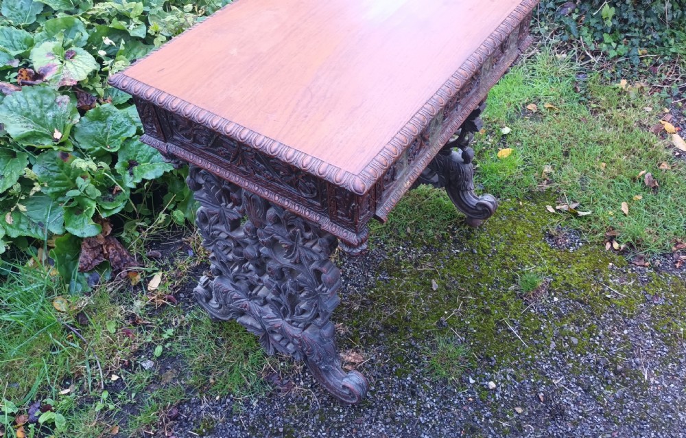 Carved Anglo Indian rosewood side table with drawer. View V
