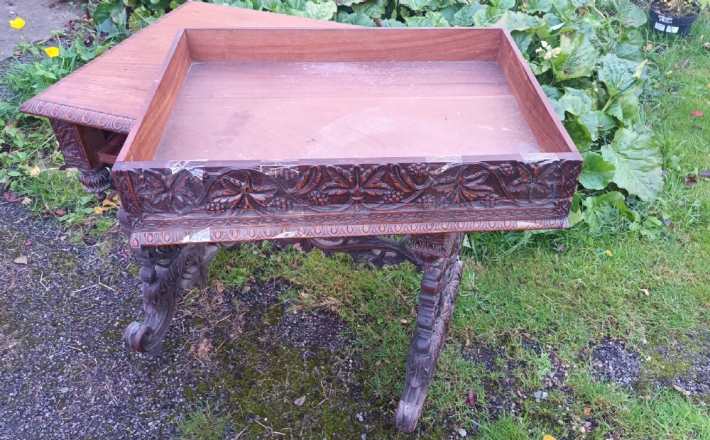 Carved Anglo Indian rosewood side table with drawer. View XII