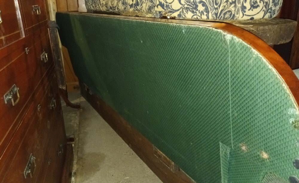 A 19th-century mahogany hall sofa featuring carved floral scroll armrests, a mahogany wooden border, and green textured upholstery. View XIV