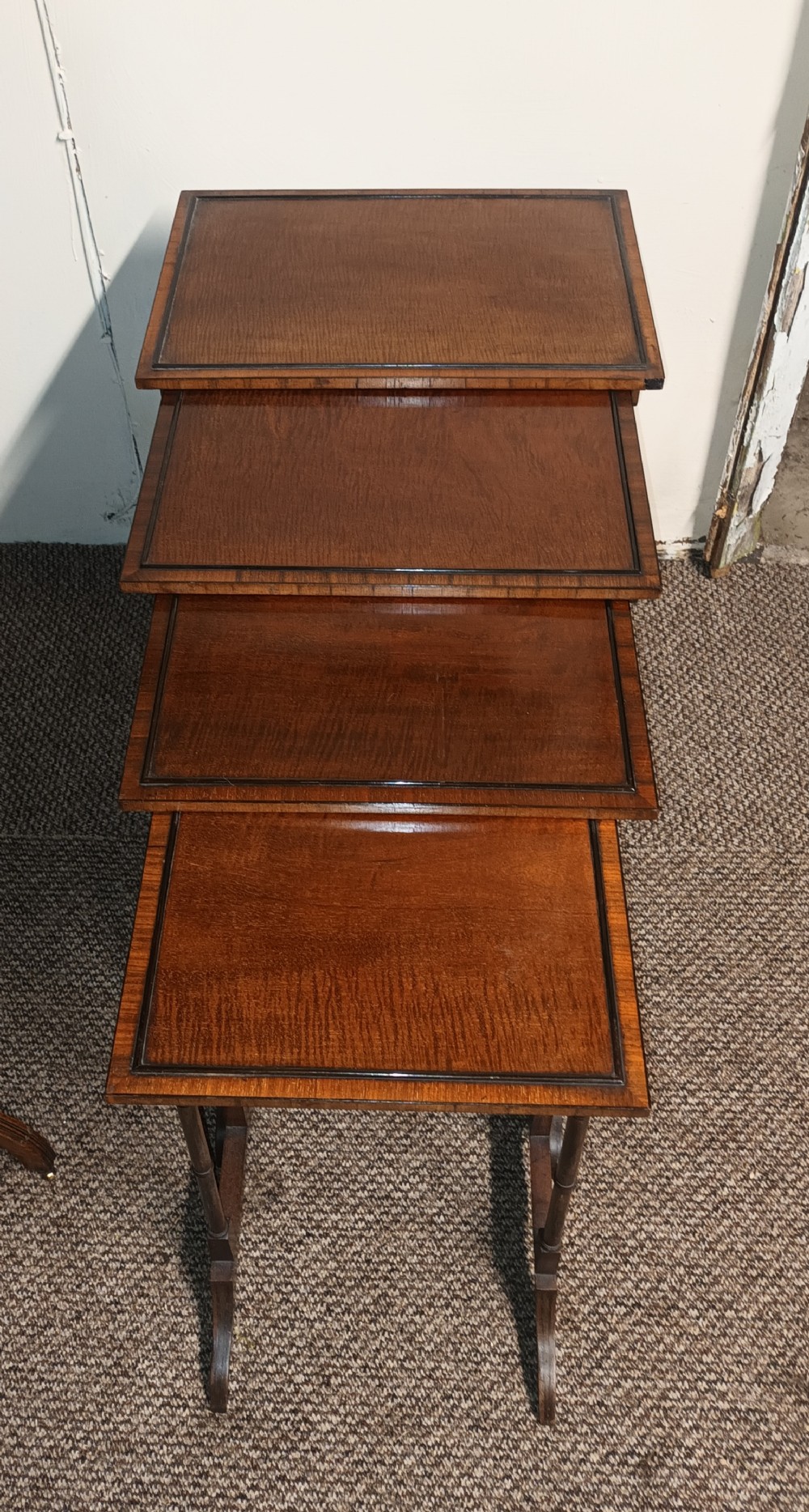 Nest of 4 mahogany occasional table.