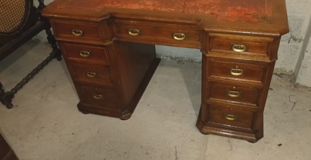 Late Victorian oak kneehole pedestal desk with side slides. View VII
