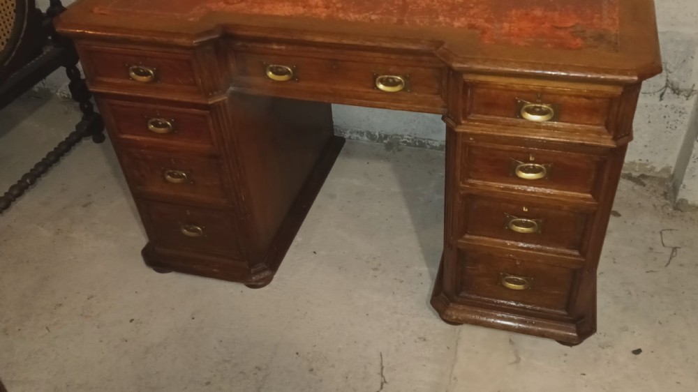 Late Victorian oak kneehole pedestal desk with side slides. View VIII
