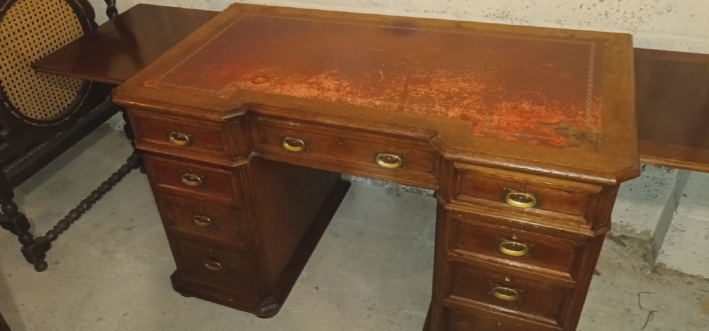 Late Victorian oak kneehole pedestal desk with side slides. View X