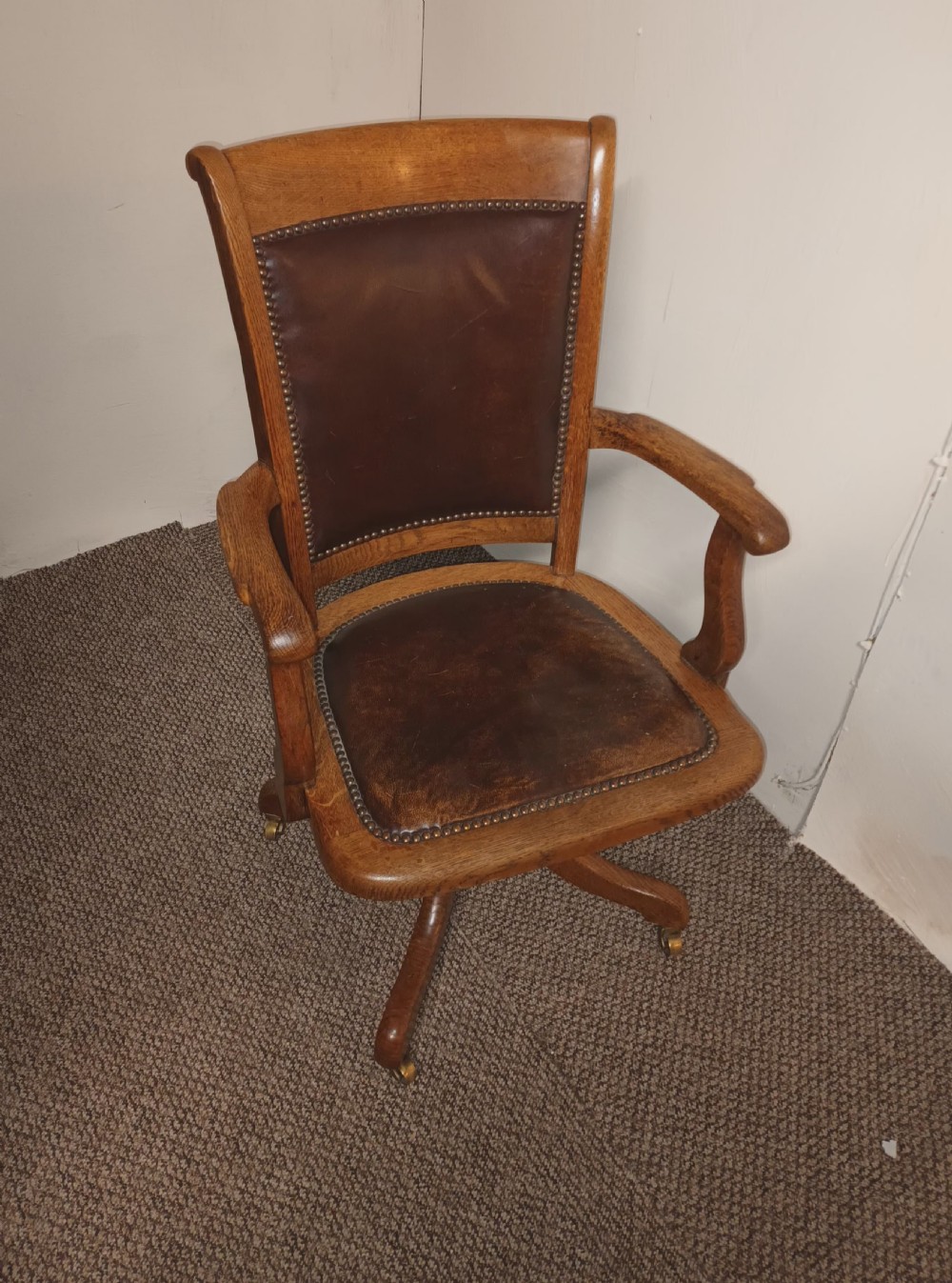Good revolving oak and leather desk armchair.  View II