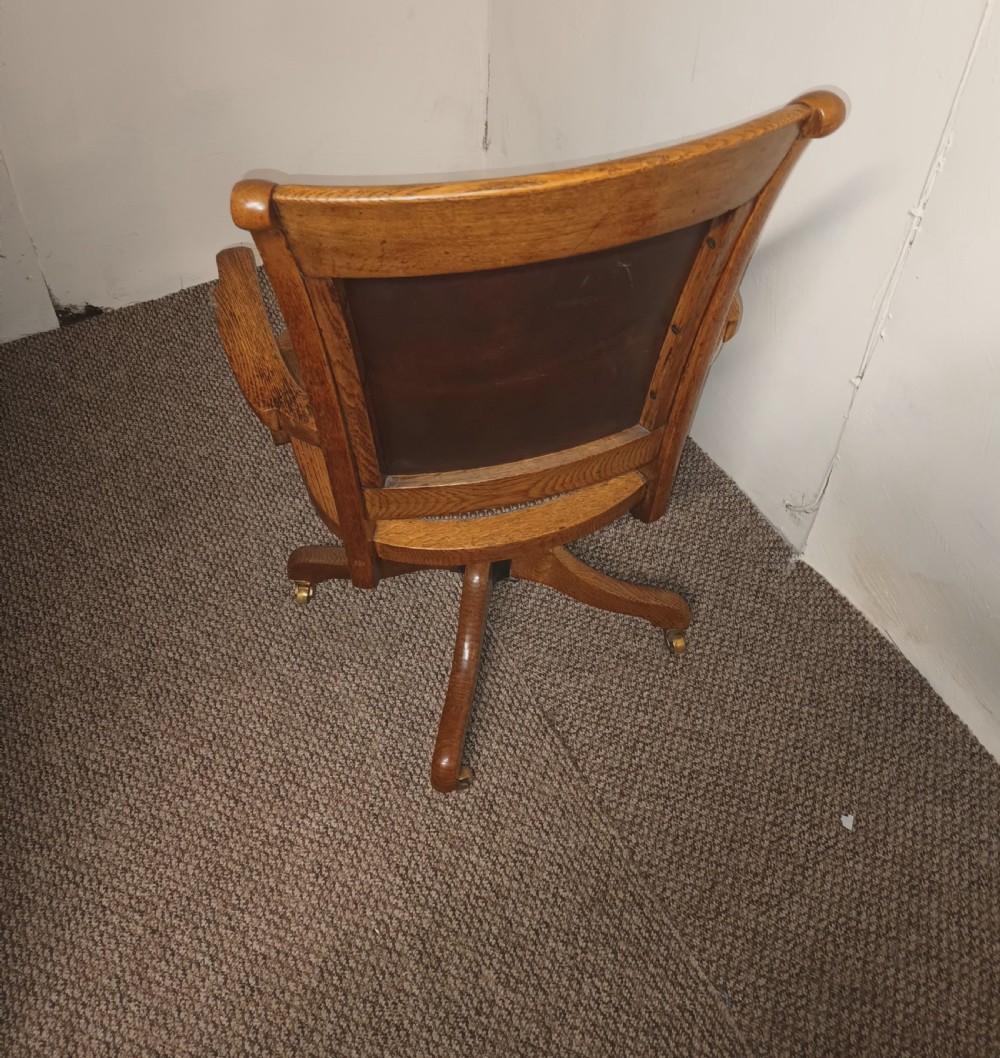 Good revolving oak and leather desk armchair.  View III
