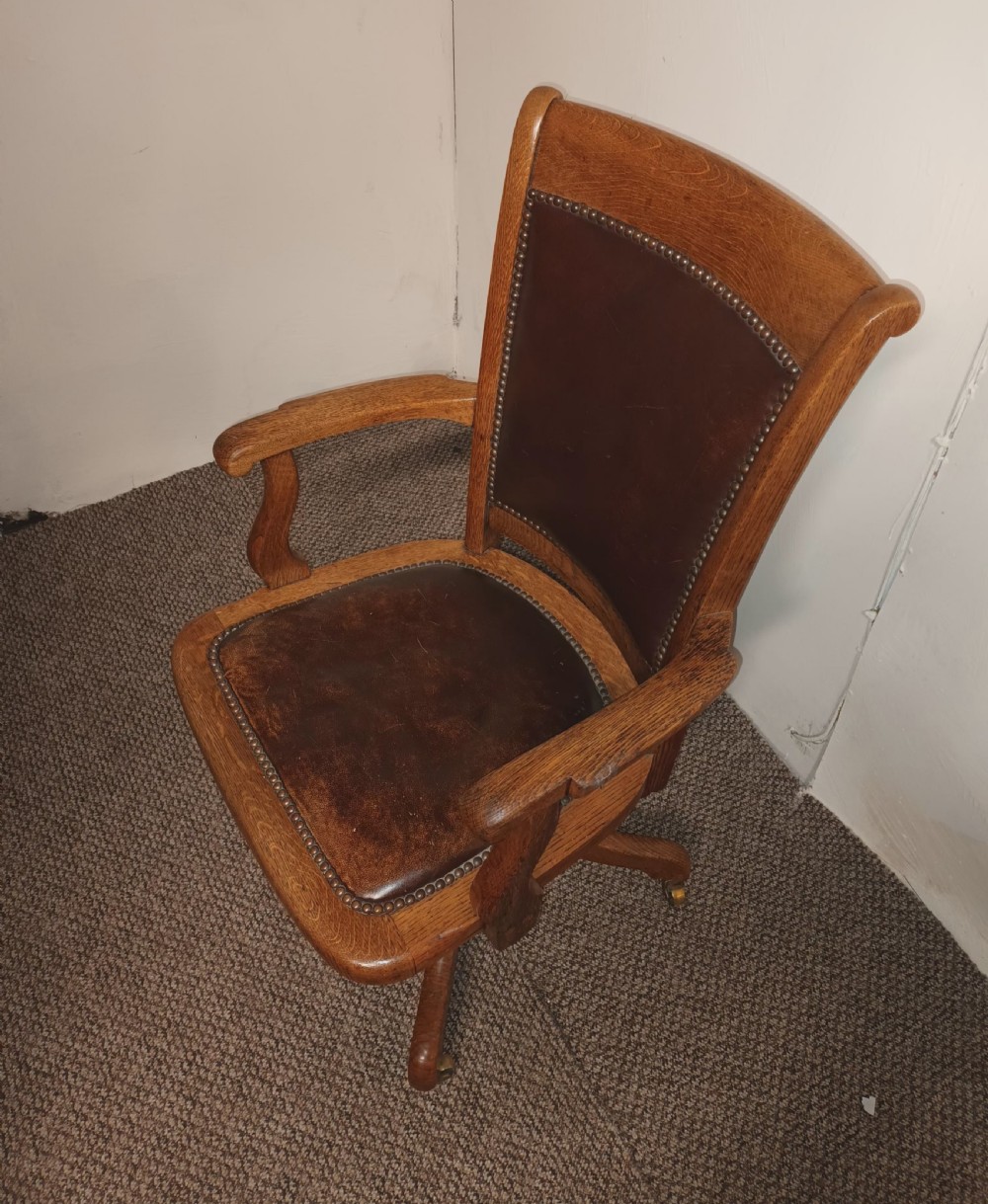 Good revolving oak and leather desk armchair.  View V