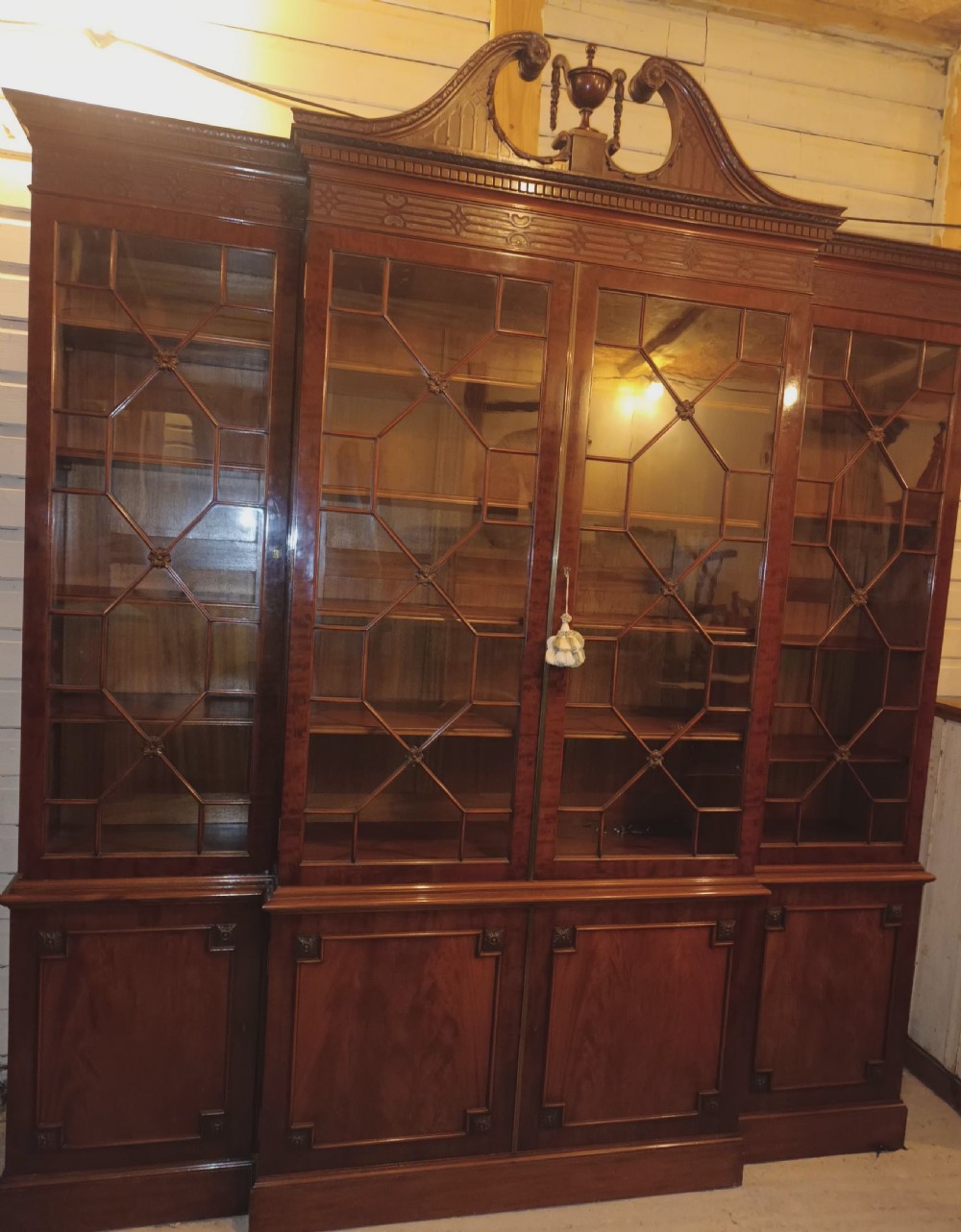 Good quality early 20th century mahogany breakfront library bookcase.  View XVI