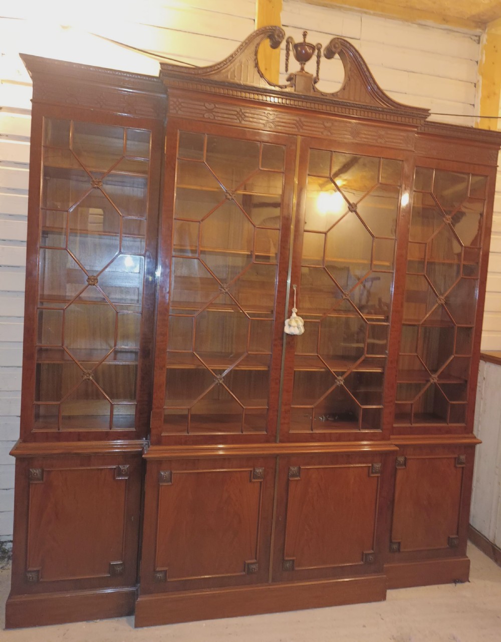 Good quality early 20th century mahogany breakfront library bookcase.  View XXI