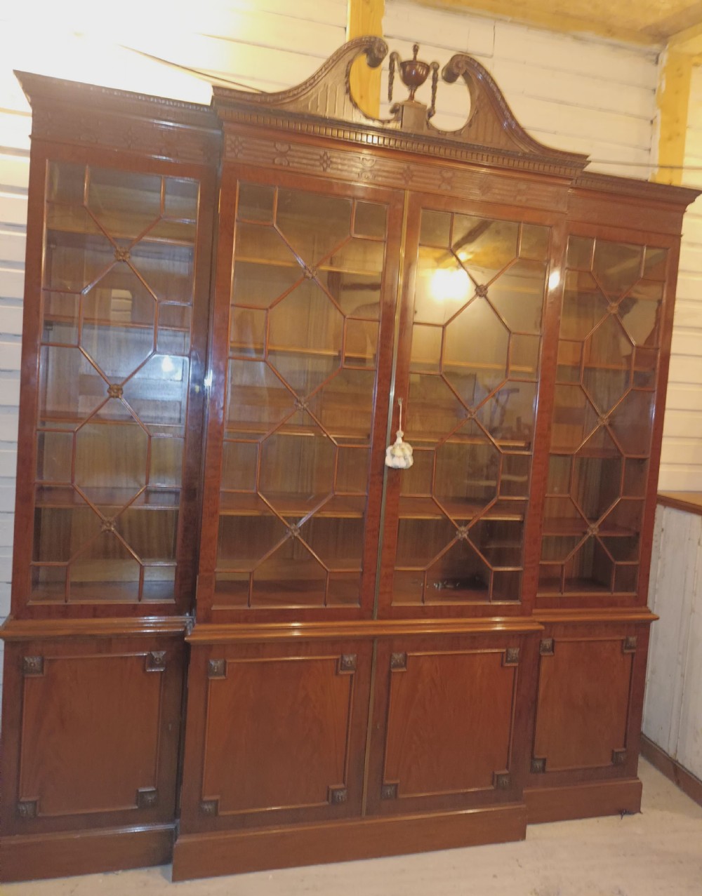 Good quality early 20th century mahogany breakfront library bookcase.  View XXII