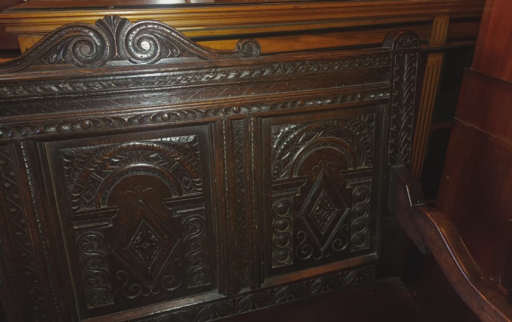 Late Victorian carved oak hall bench. View II