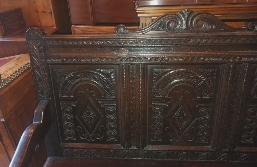 Late Victorian carved oak hall bench. View III