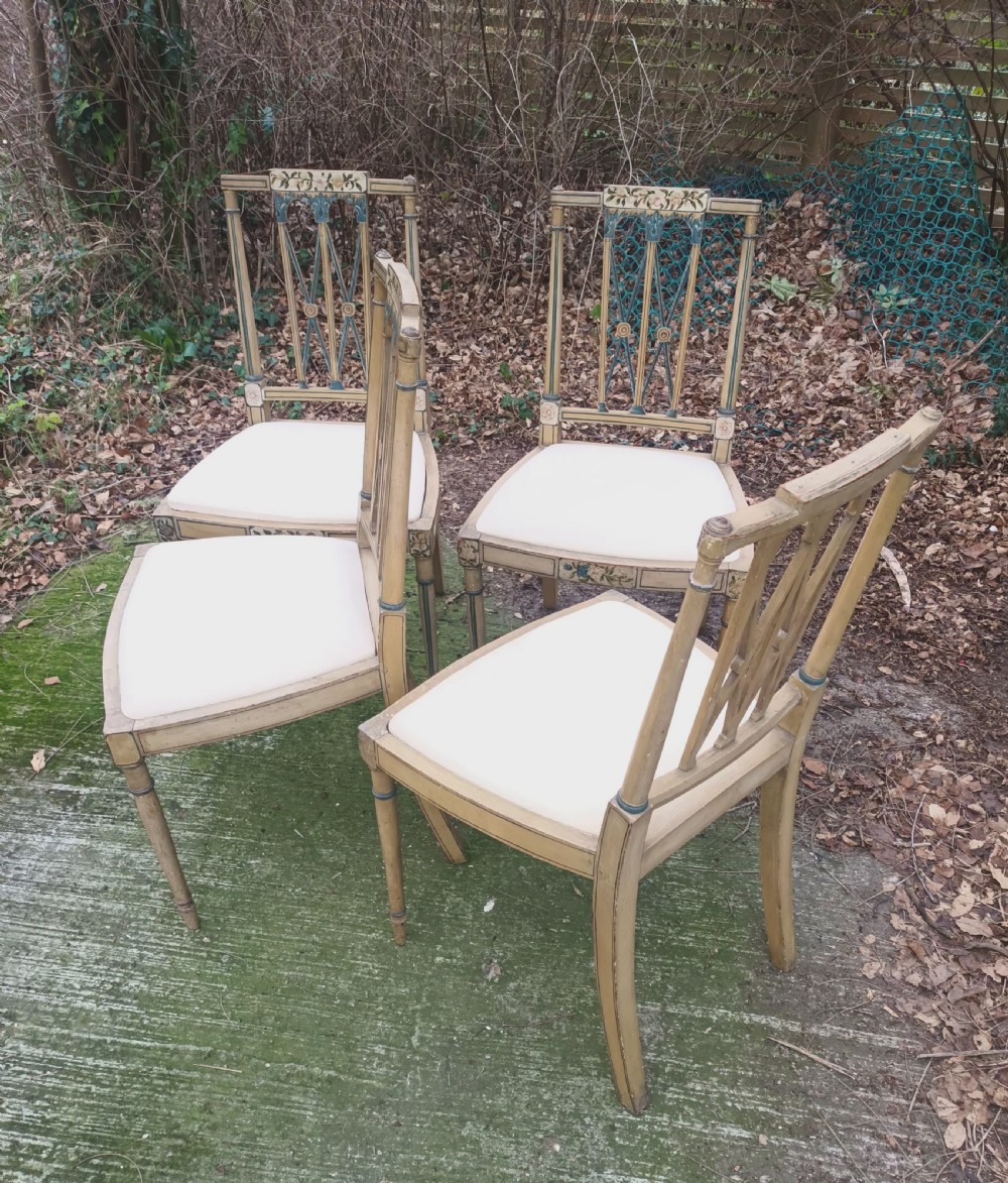 Set of 4 painted and decorated side chairs.