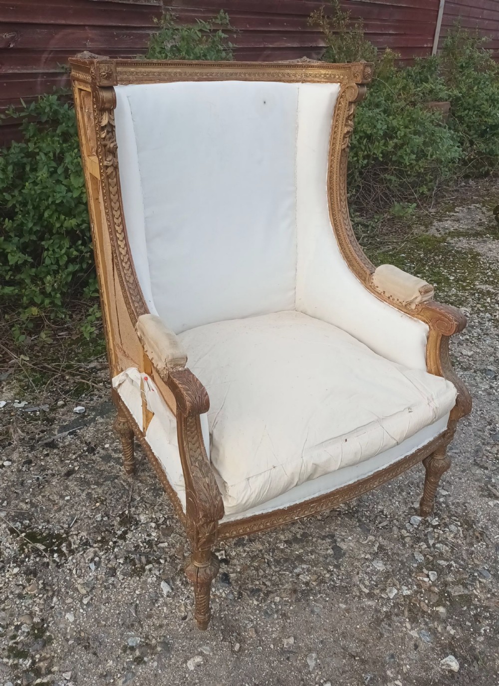 Late 19th century carved giltwood upholstered armchair .