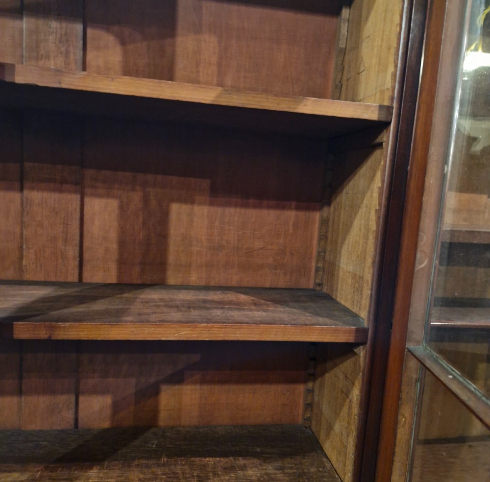 Mid 19th century mahogany breakfront bookcase of slim proportions.  View VIII