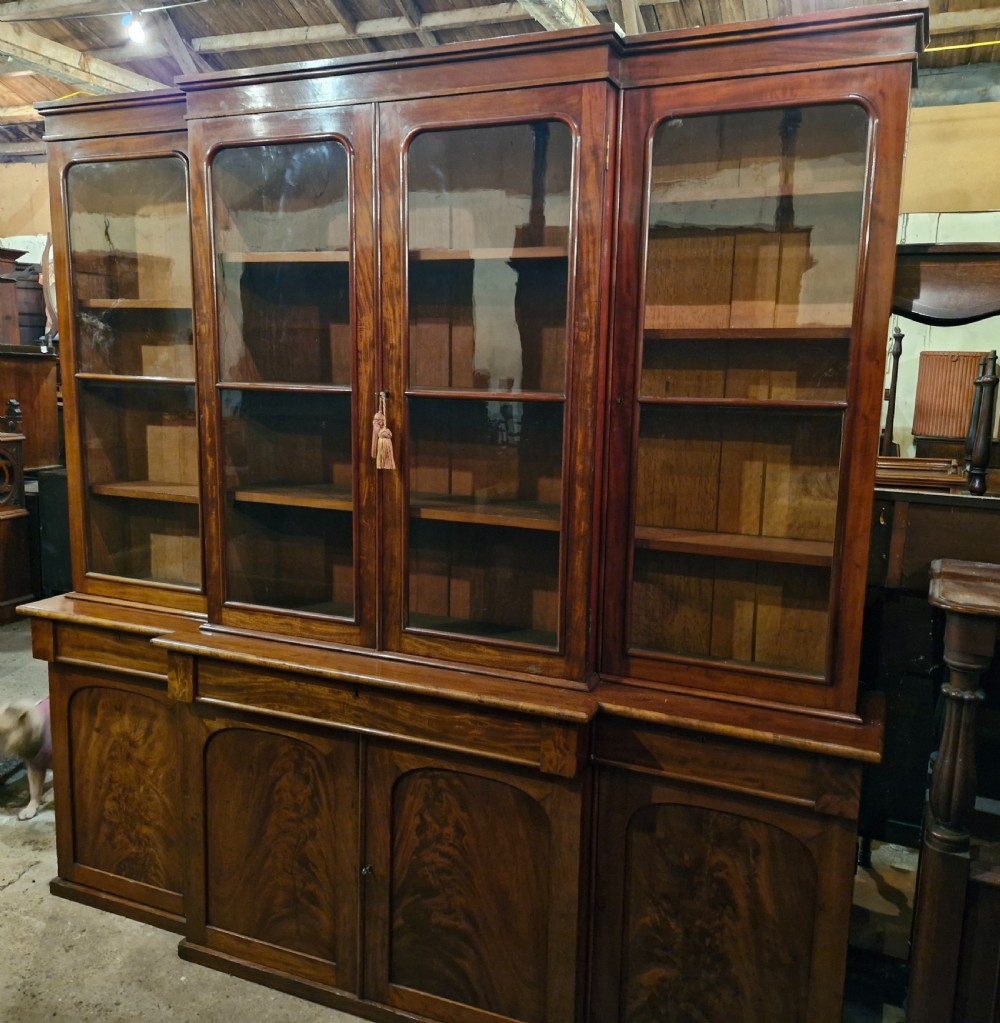 Mid 19th century mahogany breakfront bookcase of slim proportions.  View IX