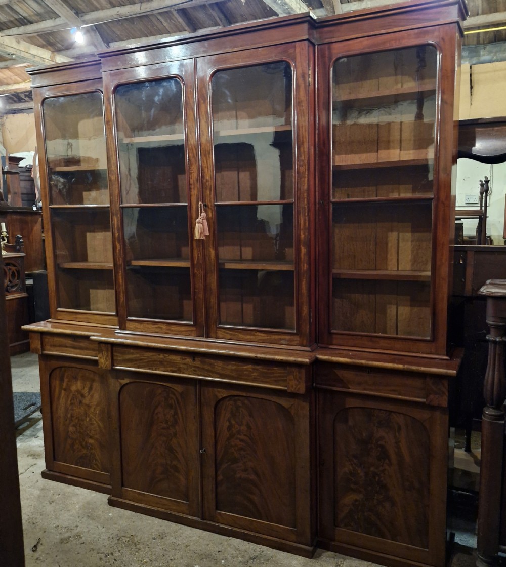Mid 19th century mahogany breakfront bookcase of slim proportions.  View XII