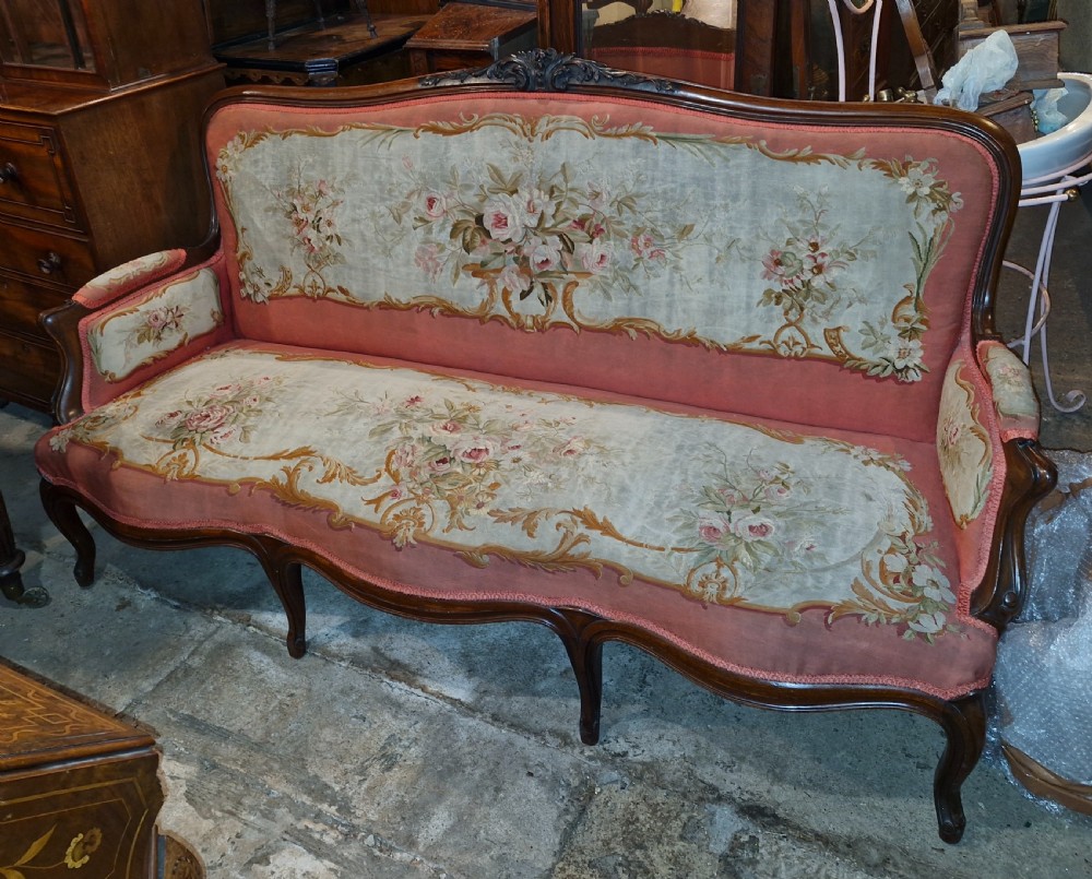 Large 19th century rosewood framed needlework upholstered sofa.