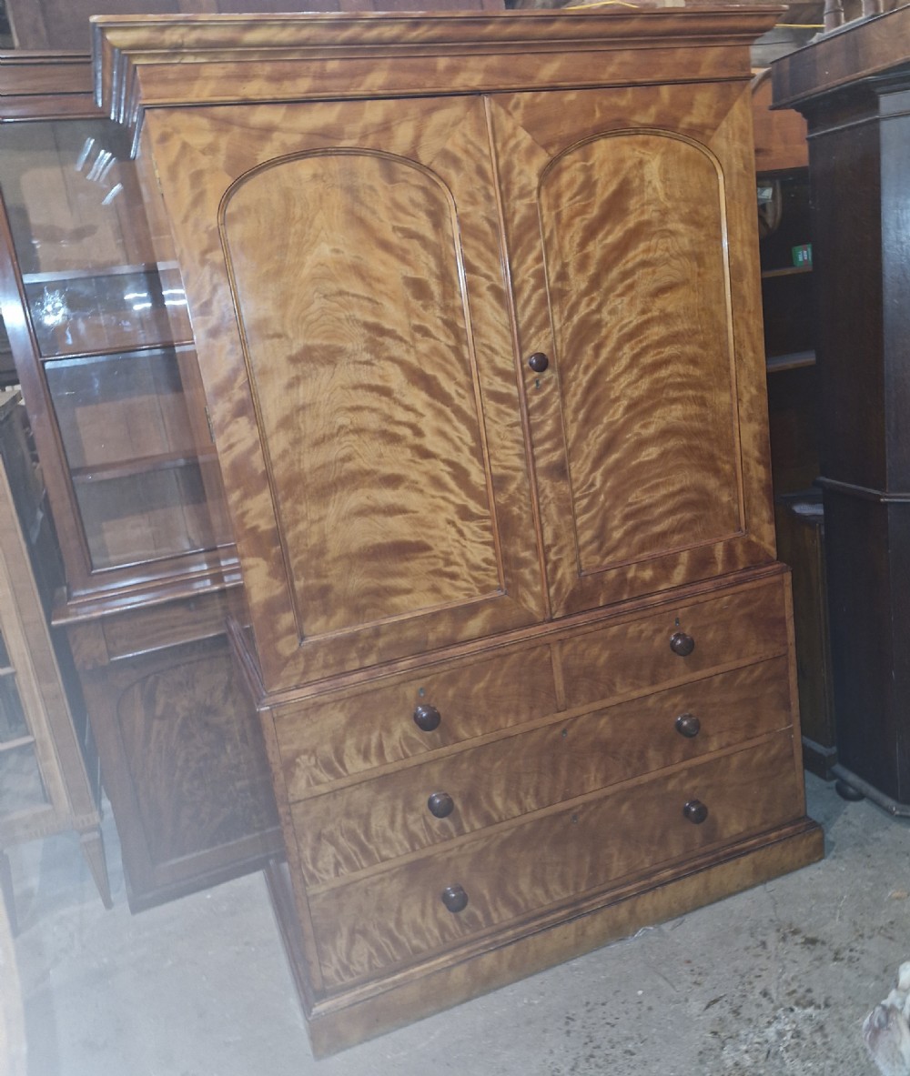 Good quality Satinbirch 2 part housekeepers cupboard.  Stamped Gillow.  View VI
