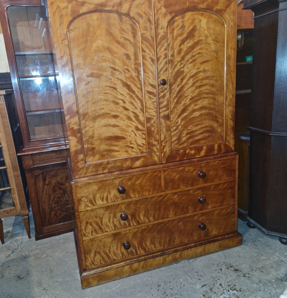 Good quality Satinbirch 2 part housekeepers cupboard.  Stamped Gillow.  View X