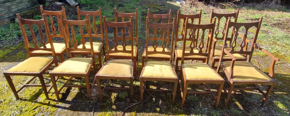 Set of 12 oak Arts and Crafts dining chairs.  View III