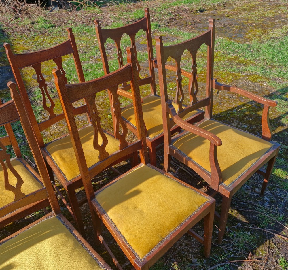 Set of 12 oak Arts and Crafts dining chairs.  View IV