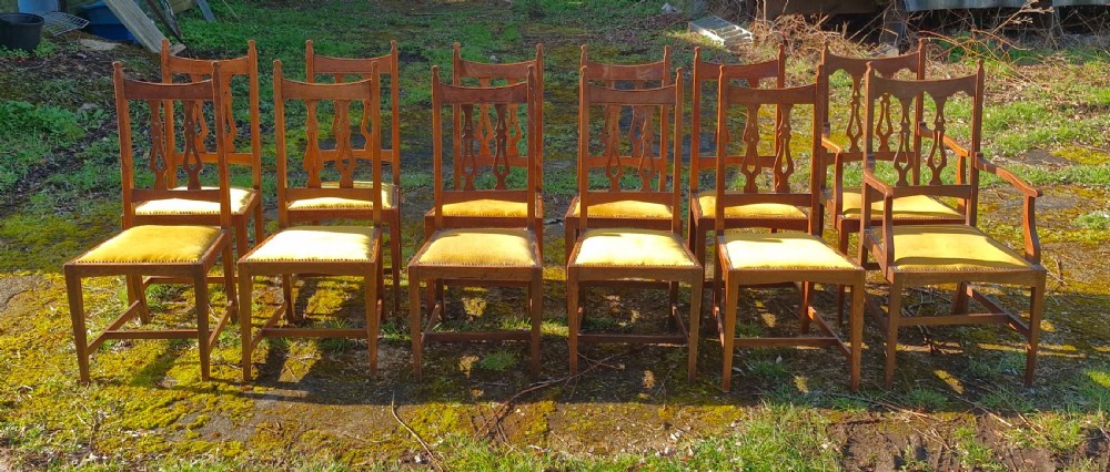 Set of 12 oak Arts and Crafts dining chairs.  View VIII