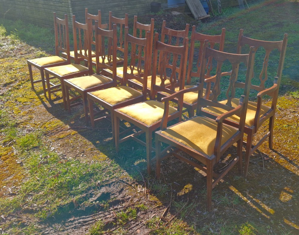 Set of 12 oak Arts and Crafts dining chairs.  View IX