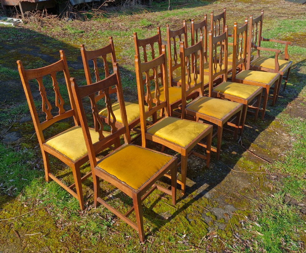 Set of 12 oak Arts and Crafts dining chairs.  View XI