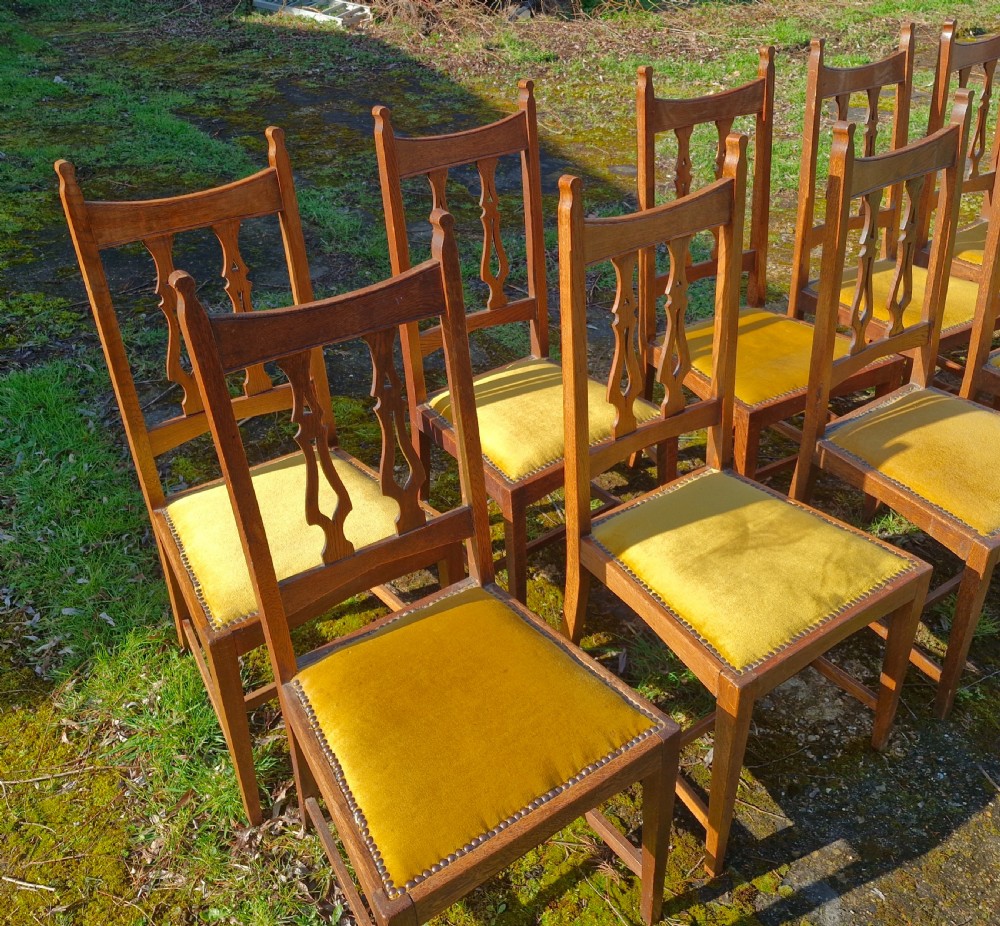Set of 12 oak Arts and Crafts dining chairs.  View XII