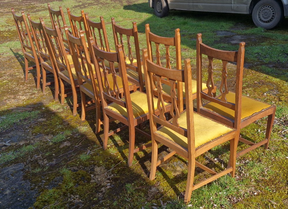 Set of 12 oak Arts and Crafts dining chairs.  View XIII