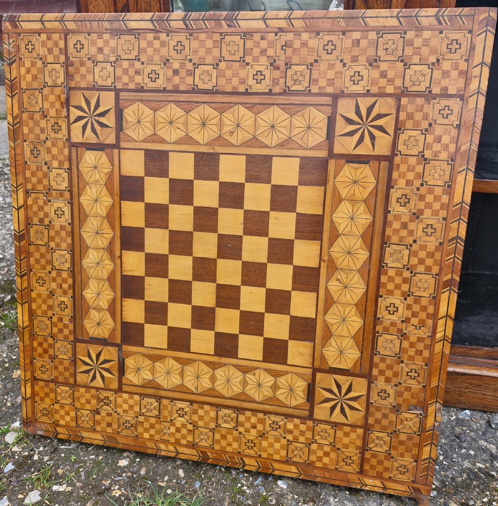 Late 19th century inlaid games table top. View II