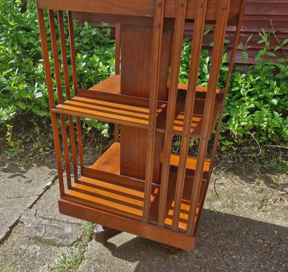 Late Victorian walnut revolving bookcase with a good gilt gallery  View IV