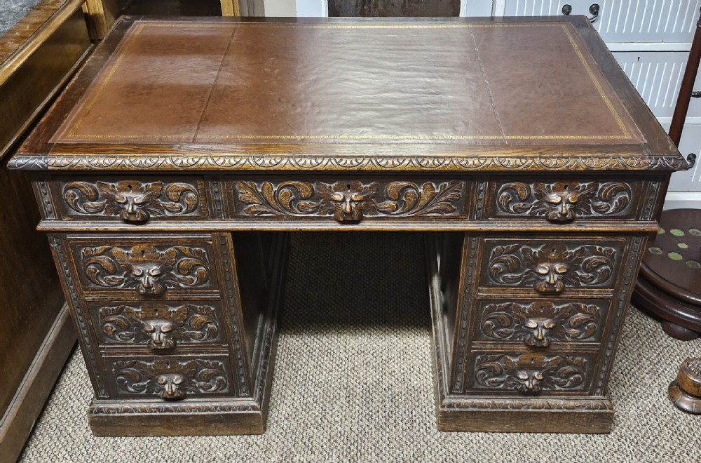 Late Victorian carved oak Greenman pedestal desk.  View III