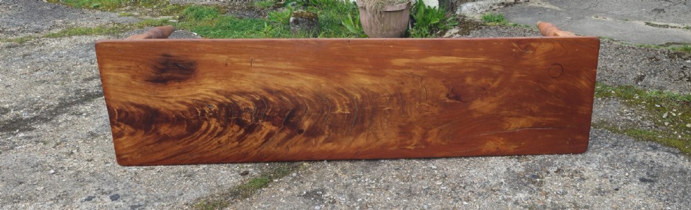 A long Victorian pine kitchen dining table featuring a single-board top with visible wood grain and four turned legs. View V