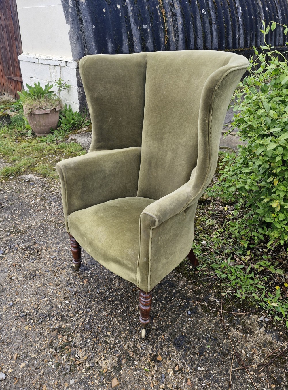 Regency mahogany upholstered wing barrel back armchair.  View IV