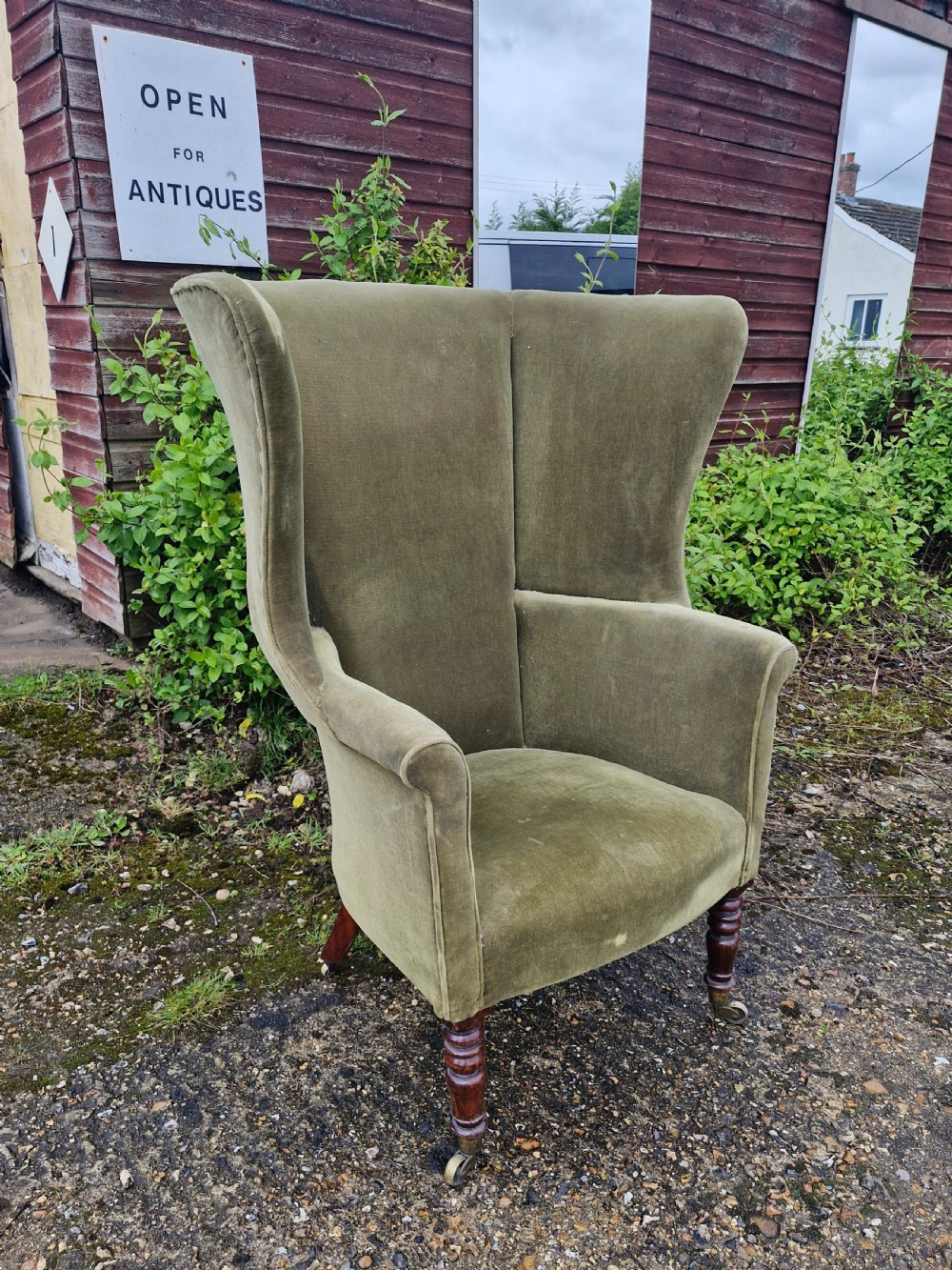 Regency mahogany upholstered wing barrel back armchair.  View V