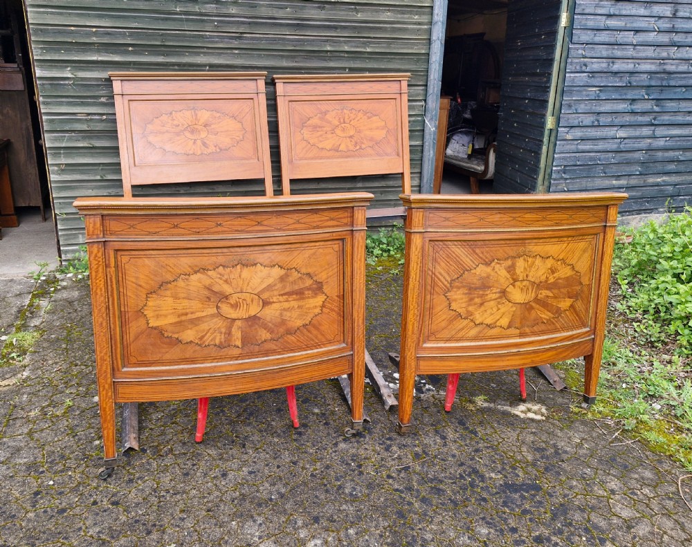 Pair of inlaid satinwood Edwardian single beds.