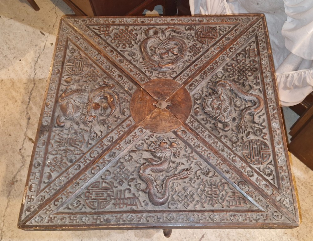 Oriental carved Envelope games table. View V