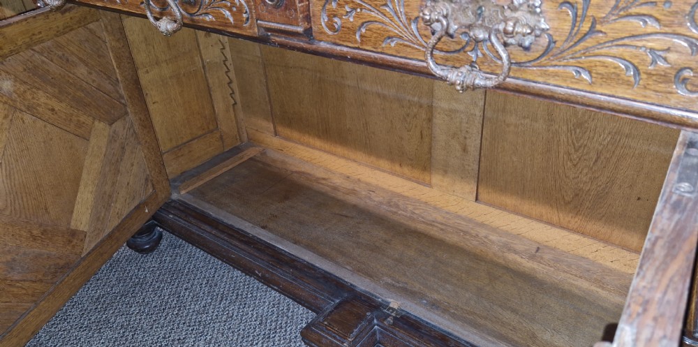 Late 19th century carved oak side cabinet.  View XIX
