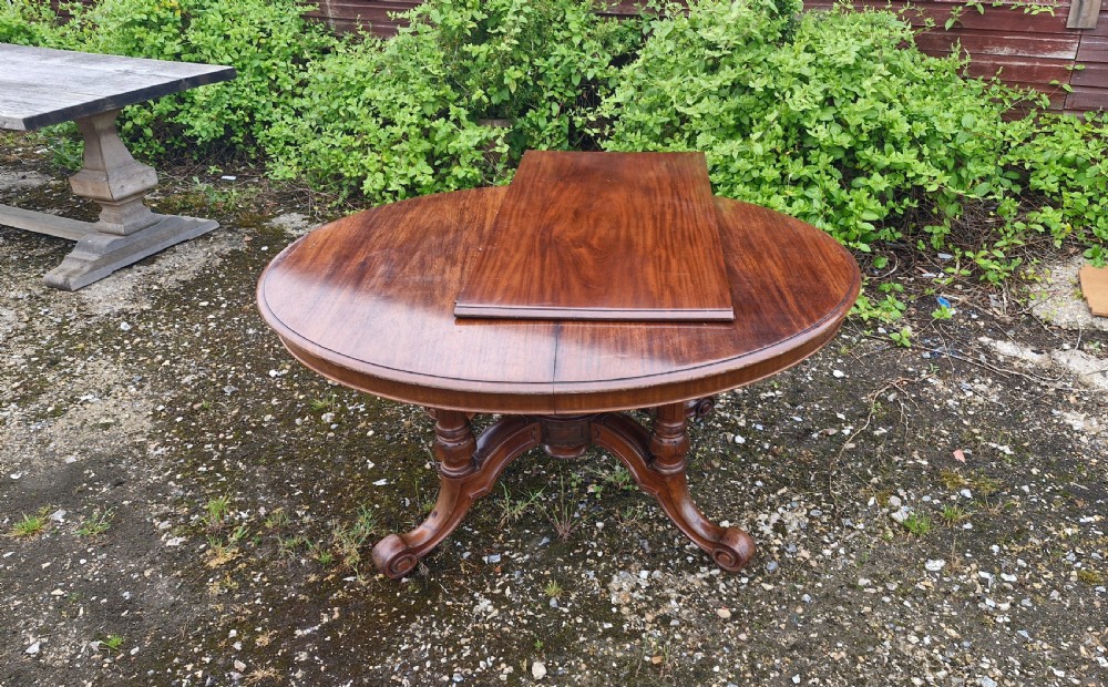 Unusual Victorian mahogany extending dining table.  View IX