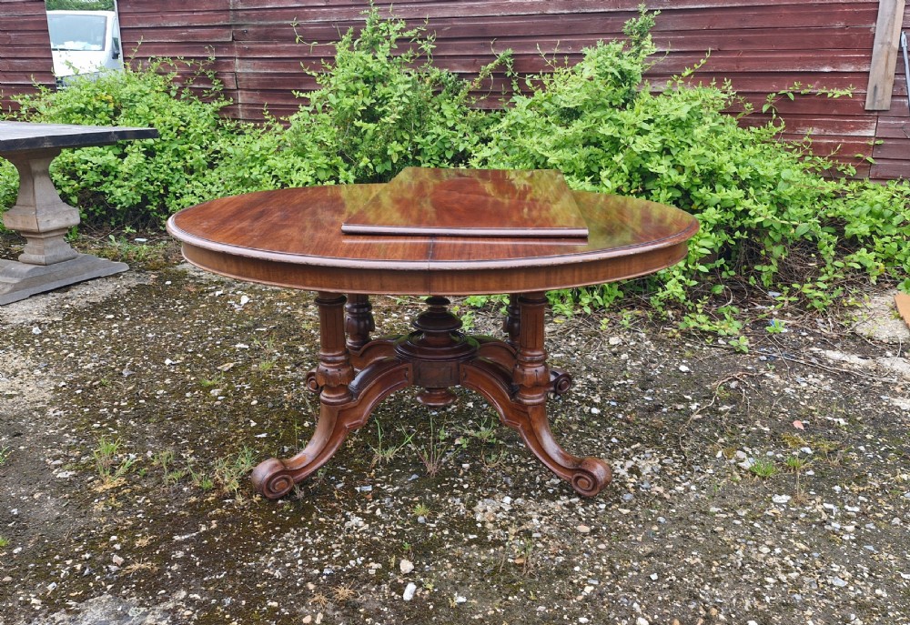 Unusual Victorian mahogany extending dining table.  View XII