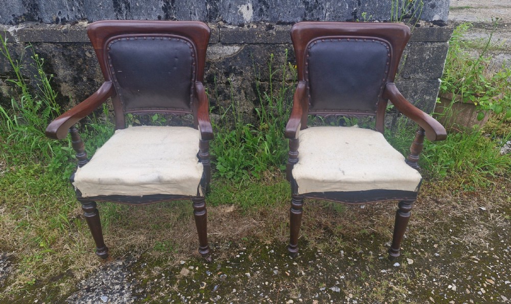 Pair of Late mahogany library desk armchairs.  View II