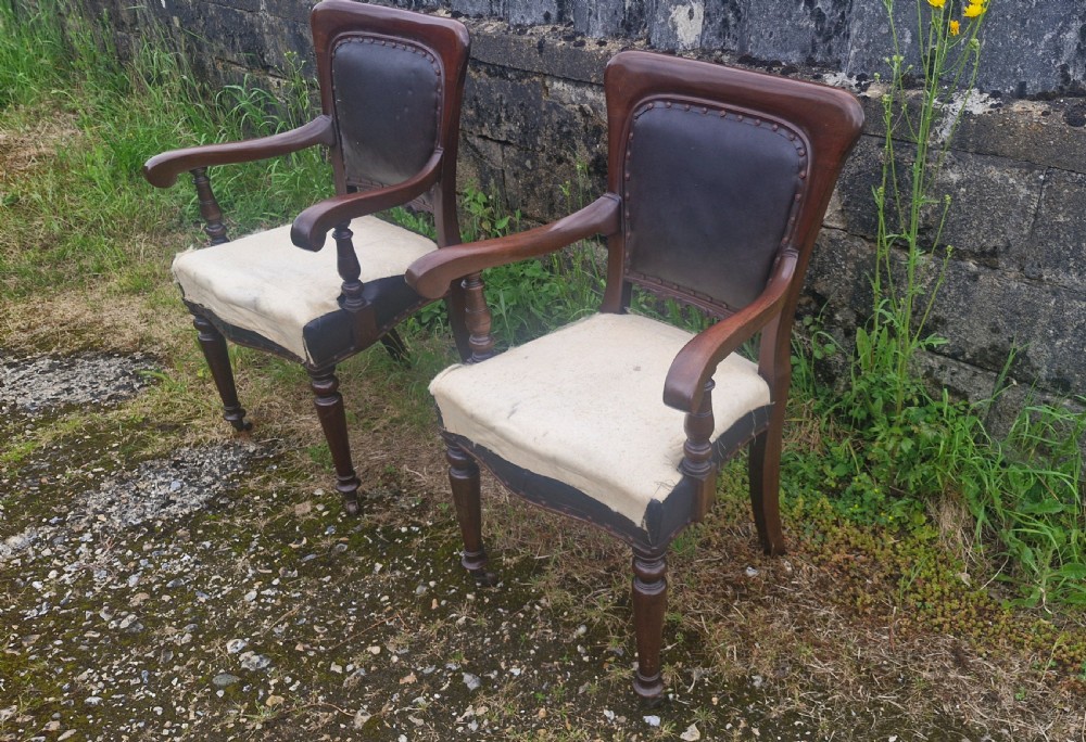 Pair of Late mahogany library desk armchairs.  View VII