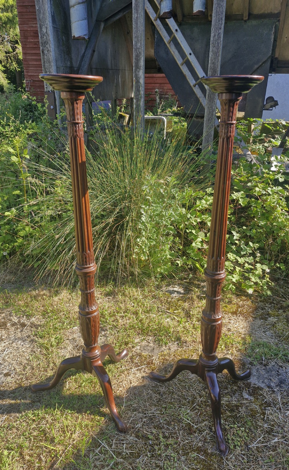 Pair of nicely carved Mahogany torchere. 