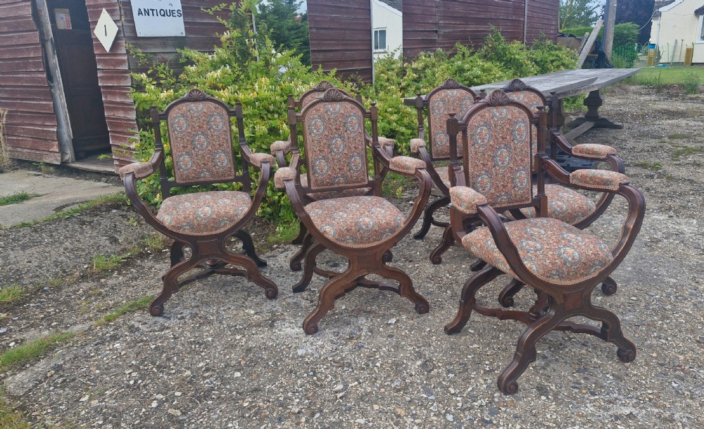 Set of 6 walnut X frame hall chairs.  View XVI