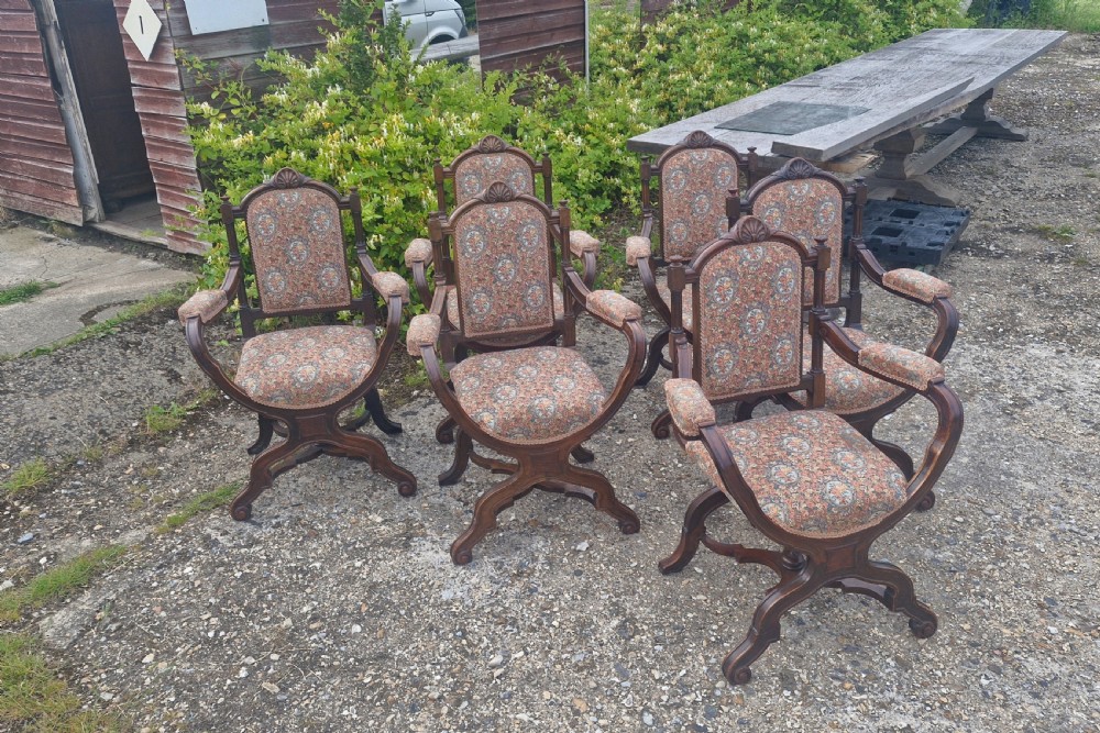 Set of 6 walnut X frame hall chairs.  View XXI